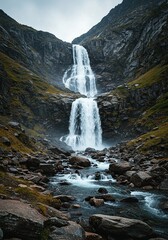 Powerful mountain stream cascading down rocky slopes from a high peak, illustrating natural force and pristine wilderness ,river ,landscape ,rock