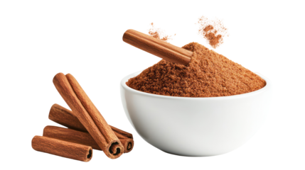 Ground cinnamon and cinnamon sticks in a white bowl isolated on transparent background