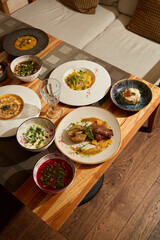 Indulge in Delicious and Wholesome HomeCooked Dishes Served on a Rustic Wooden Table