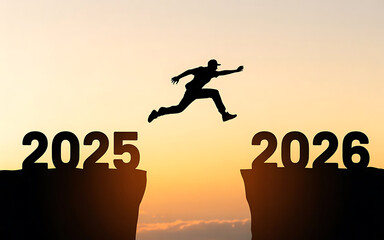 Jumping into 2026: Silhouette of Man Leaping Over Cliff Gap at Sunset