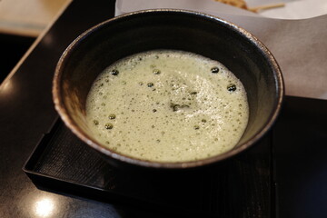 Matcha tea in traditional ceramic bowl