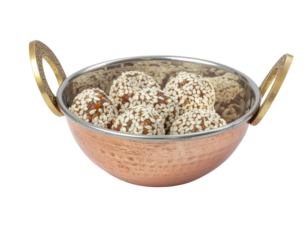 Sesame seed balls in copper bowl sweet treat snack food dessert confectionery isolated