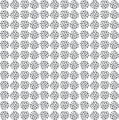 Circular masses of dots repeat to create texture.