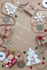 An arrangement of Christmas decorations with Merry and Bright in the middle.