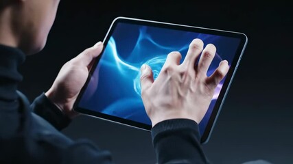 A person using a futuristic tablet with a high-tech holographic user interface and data display - Powered by Adobe
