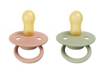 Pink and green baby pacifiers on transparent background