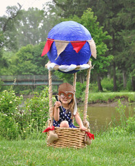 Gilr Pretending to Fly Outside