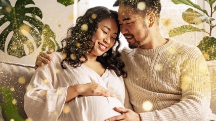 Expectant Asian couple gazes lovingly at a pregnant belly, embraced by leafy plants - Powered by Adobe