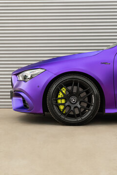 Matte purple Mercedes-AMG CLA 45s front wheel closeup, Performance coupe yellow caliper detail