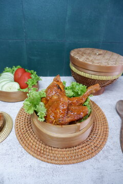 Roasted Spiced Chicken with Coconut Milk as Ayam Percik in preparation for iftar during the fasting month of Ramadan