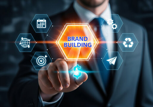Businessman interacting with digital brand building interface and business strategy icons.