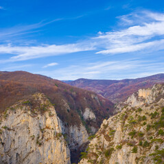 mountain canyon under a blue cloudy sky