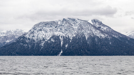 snow covered mountains in winter San Carlos de Bariloche Patagonia Argentina glacial lake Nahuel Huapi, next to the Andes Mountains
