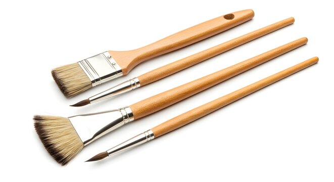 Diverse set of clean art paintbrushes with wooden handles, isolated on white background for creative projects