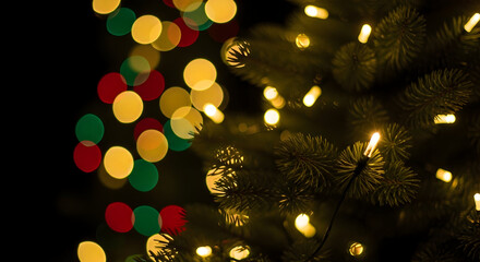 A magical Christmas background with glowing golden bokeh lights on a dark fir tree an elegant and festive holiday wallpaper 64141898 1