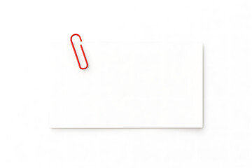 Red paper clip on a white business card
