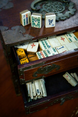 An antique Mahjong set in a drawers cabinet - vertical