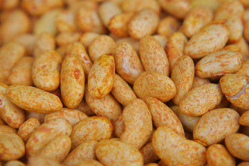 Freshly roasted almonds in a market display