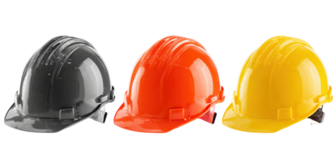 Set of construction safety hard hats in black orange and yellow