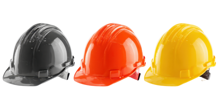 Set of construction safety hard hats in black orange and yellow