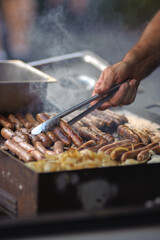 Sausages sangas! Australian barbecue with sausages and steak sandwiches - vertical