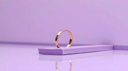 Single Gold Ring Displayed on a Soft Purple Surface
