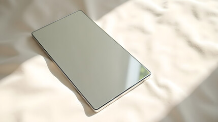 Rectangular Mirror Objet Resting on Soft Fabric
