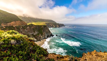 Coastal view of rugged cliffs meeting the ocean under a cloudy sky