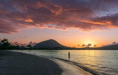 Greeting the Sunrise at Kuliouou Beach Sunsrise in Hawaii Kai, Oahu, Hawaii, USA