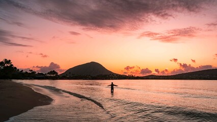 Greeting the Sunrise at Kuliouou Beach Sunsrise in Hawaii Kai, Oahu, Hawaii, USA