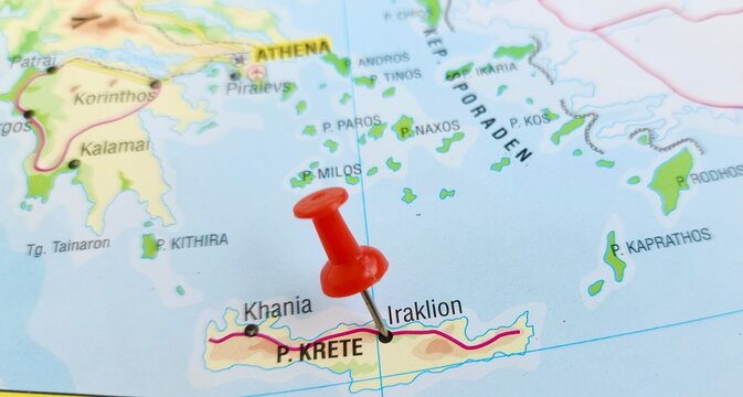 Fototapeta View of Heraklion, Herakleion or Iraklion, is the largest city and the administrative capital of the island of Crete, on a geographical map of Europa, marked with red pushpin