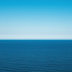Obraz premium A serene expanse where the vast blue ocean meets the clear sky at a distant, seamless horizon line. Reflects peace and infinite possibilities ,reflection ,sunlight ,horizon