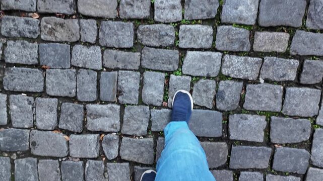 Walking on cobblestone pathway in a quaint town