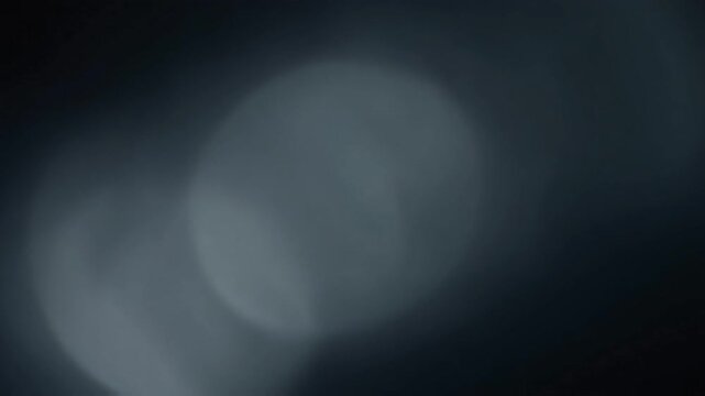 Abstract blurry lens effect, moody atmospheric fog background loop.