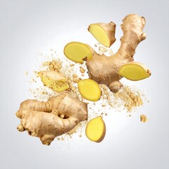 A vibrant image showcasing various sizes of a spice root and its sliced pieces, with a powder explosion