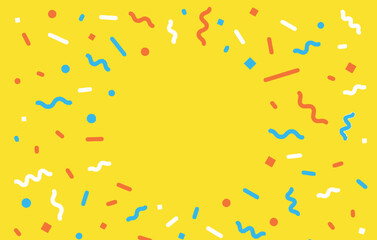 Confetti on yellow background, celebration, party, festive, fun.