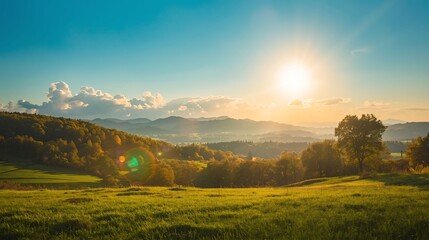 Obraz premium Vibrant Sunny Landscape: Clear Sky, Green Hills, and Golden Light