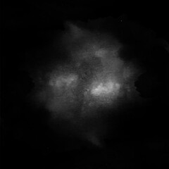 A grayscale image captures the ethereal glow of a distant nebula against the vast darkness of space...