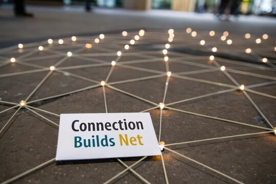 Card displaying connection text on an illuminated network of nodes