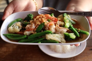 Close-up of stir-fried vegetables with shrimp, a healthy dish.