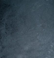 Abstract textured background with subtle variations in dark blues and greens creating a mottled organic appearance
