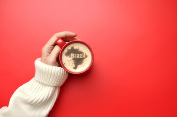 Cup of coffee with the silhouette of Brazil and the inscription 