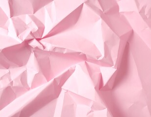 Close-up of softly lit, crumpled, pastel pink paper texture