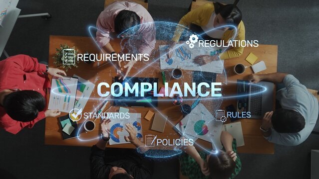 A diverse team engages in a collaborative meeting focusing on compliance strategies, discussing regulations, policies, and standards to drive business success. Raster