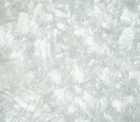 Abstract textured background with soft white and pale green hues creating a gentle ethereal and slightly blurred visual effect for design