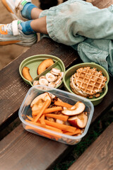 Healthy Kids Lunch Box Outdoors. Food snacks for children on the street.