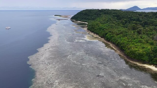 A beautiful coral reef fringes Pulau Hatta, in the remote Banda Islands of Indonesia. This region harbors extraordinary marine biodiversity and is a popular destination for divers and snorkelers.