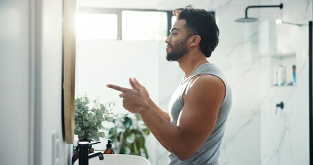 Finger gun, mirror and man in bathroom, muscle growth and grooming with morning routine. House,...
