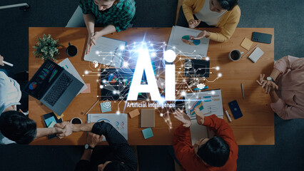 A dynamic overhead view of a diverse team collaborating in a modern office, utilizing artificial intelligence insights to drive innovation and strategize for future success. Trope