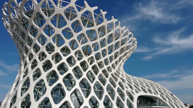 Futuristic White Parametric Architecture Building Against Blue Sky.